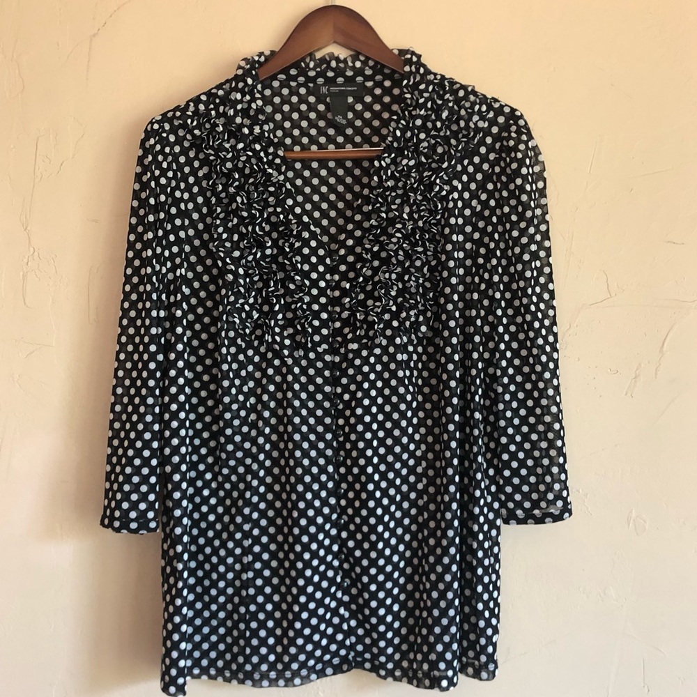 INC. Black and white polka dots, ruffles, perfect blouse for work or after.
